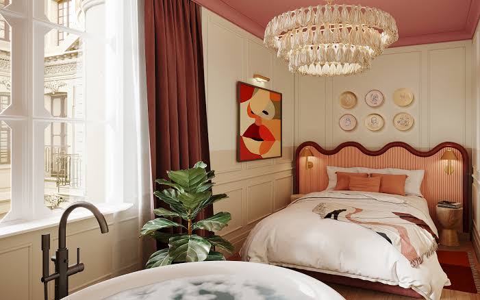 Elegant guest room at Les Jardins de Verre in Paris, with tall windows and a crystal chandelier